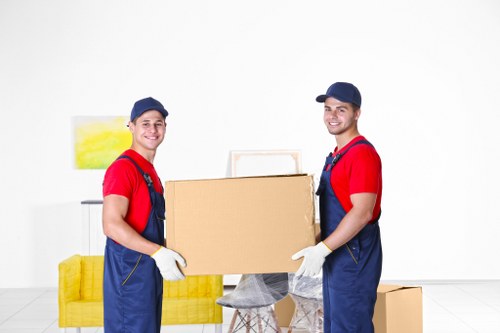 Removal van and movers planning access on an East London street