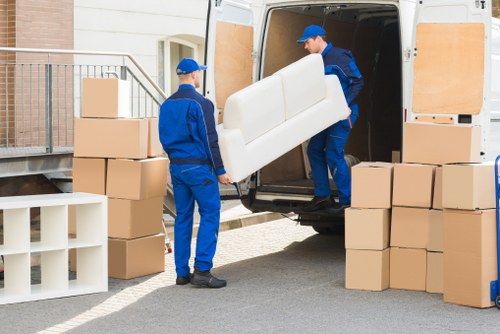 Packed boxes and furniture ready for a local home removal