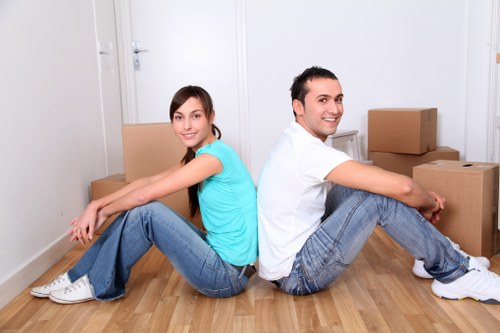 Careful loading of bulky furniture for pickup in Shacklewell