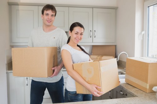 Home moving service handling furniture in a Shacklewell flat